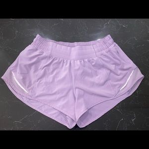 Size 6 Lululemon shorts in great condition. The color is a purple/ pink color.